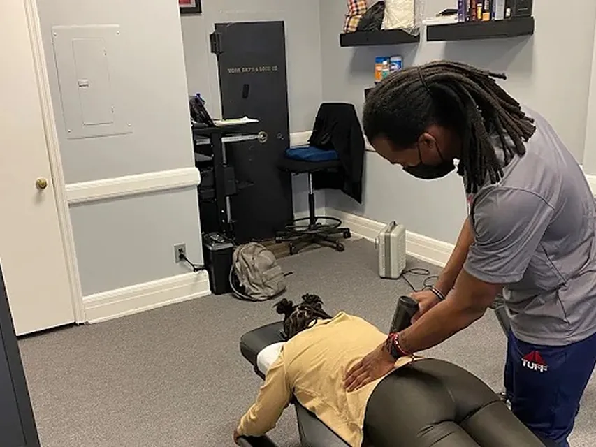 Dr. Lewis treating a patient's lower back at Tuff Spine